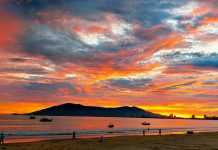 Dawn breaks over coastal fishing village
